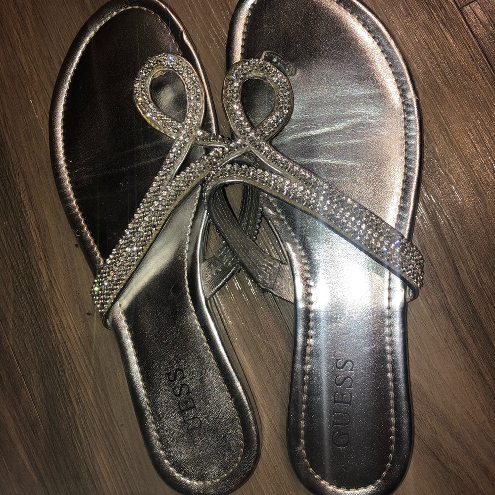 Silver studded Guess flip flops